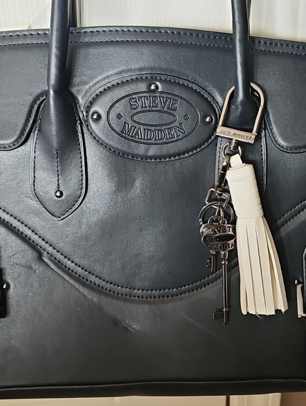Steve Madden Black Tote with Cream Tassel Charm